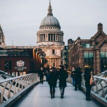 People walk across the Millennium Bridge